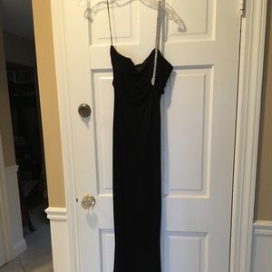 Black prom gown with rhinestone snake shoulder.